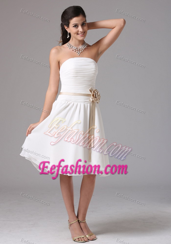 White Strapless Knee-length Ruched Dama Dress with Brown Sash and Flower