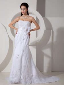 Elegant Mermaid Strapless Brush Train Wedding Dress with Lace and Sash