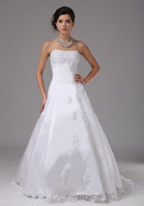 A-line Romantic Lace Strapless Wedding Dress with Brush Train and Appliques