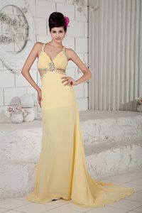 Light Yellow Empire Sweep Train Evening Celebrity Dresses with Cutouts on Sides