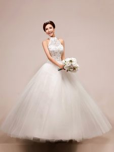 Designer White Halter Top Neckline Beading and Appliques Wedding Gowns Sleeveless Lace Up